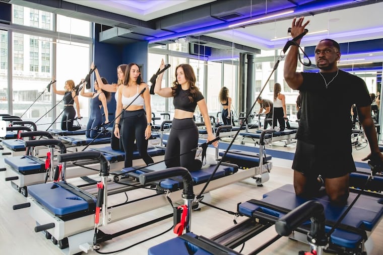 What a class at one of the dozen Philly-area Jetset Pilates studios might look like, once the local studios open in the coming years. The full-body workouts are done on a Reformer, a bed-like machine with a rolling carriage, adjustable springs, and straps that practitioners use to push, pull, or hold steady, depending on the exercise.