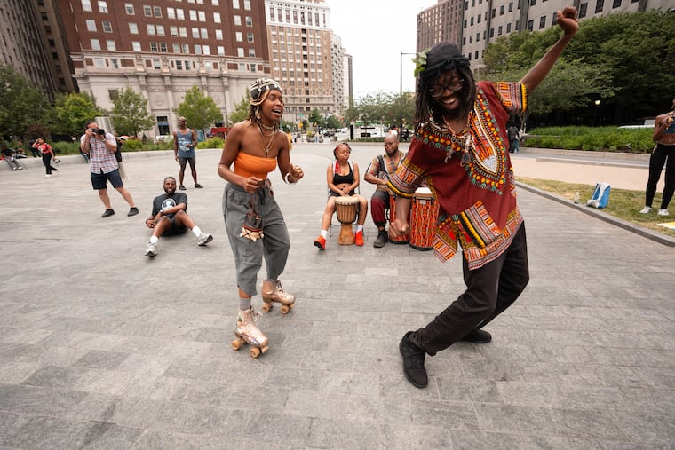 Artists Angie Scott, left, and Sheen Anthony, right, dance while A1love, back left, and Brother Michael, back right, play music, June 6, 2025, in Philadelphia, at an outdoor event at LOVE Park with live music, vendors, games, and community togetherness, A Love Jawn Event. Love Jawn Events are free at LOVE Park: 1500 JFK Blvd, a time for people to gather together to celebrate the heart of the city with live music, local vendors, food, and community love. Presented by Thinker Makers Society in collaboration with Councilman Jim Harrity — it’s free, it’s for the community, in the heart of Center City. The next Love Jawn event is Juneteenth, Thursday June 19th at Love Park.