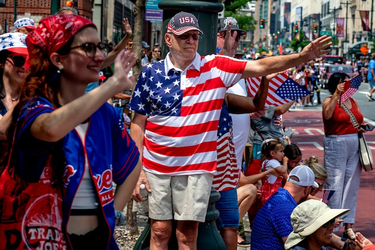 Revelers during the Salute to Independence Parade on Market Street in 2024.