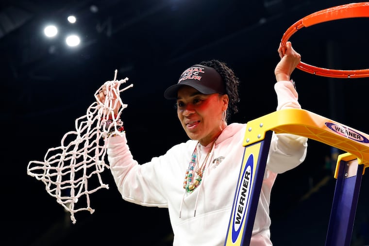 South Carolina head coach Dawn Staley cuts down the net after defeating Duke to advance to the Final Four of the NCAA college basketball tournament, Sunday, March 30, 2025, in Birmingham, Ala. 