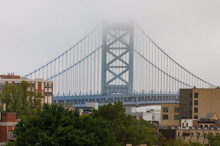 Foggy morning in Center City Philadelphia, Friday, Sept. 27, 2024. Ben Franklin Bridge tower covered with fog.