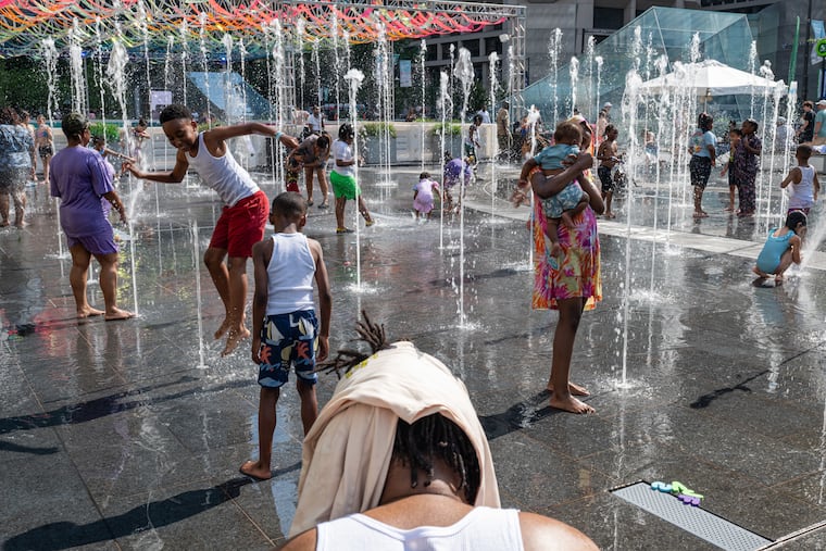 Children play in the Dilworth Park water feature on Saturday. Better keep that water running this week.