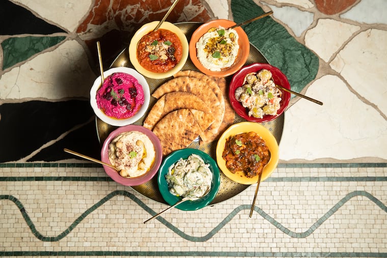 The complimentary mezze and pita platter at Dear Daphni, a new Mediterreanan restaurant near Rittenhouse Square from the Schulson Collective.
