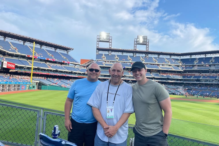 John DiSangro, center, with his brother Steve and nephew Rocco before a Phillies game at Citizens Bank Park.