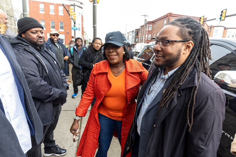 Mayor Cherelle L. Parker is greeted by City Councilmember Jeffery Young (right) during a tour through Strawberry Mansion in 2024.