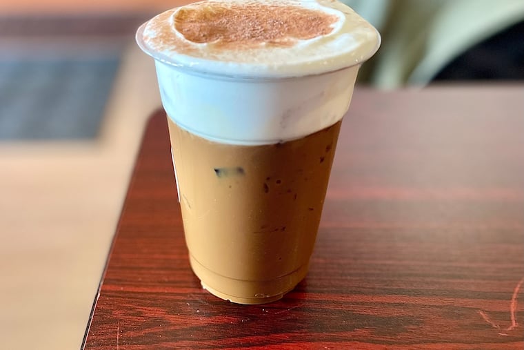 Salt foam coffee is a specialty at Saigon Grace Cafe that tops Vietnamese coffee with whipped cream seasoned with sea salt.