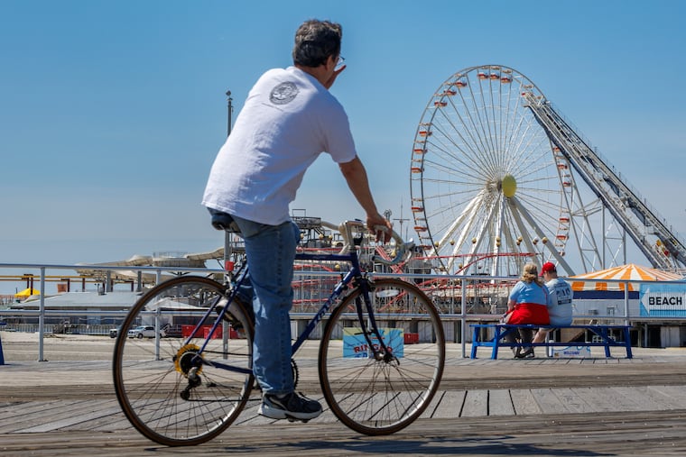 People enjoy the boardwalk near Morey's Pier in Wildwood on a quiet morning earlier this month.