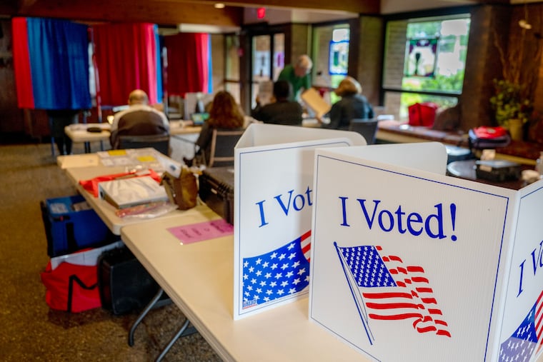 Vote signs on partitions for provision ballots at the election polling place inside St. Michael’s Church, at King’s Highway and Chapel Avenue, in Cherry Hill.