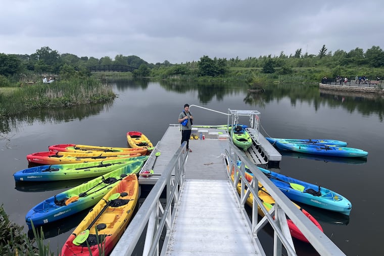 Jaycel Santos,  20,  of Camden, at a boat launch in a pond leading to the Cooper and Delaware Rivers in Camden. Santos helps operate weekly boat rides for the nonprofit Upstream Alliance.