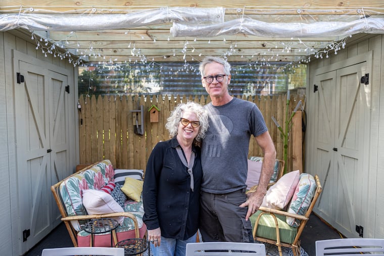 Christopher Poehlmann, owner of CP Lighting, and his wife, Kate Kramer, a lecturer in critical writing at University of Pennsylvania, at their home in West Philadelphia.