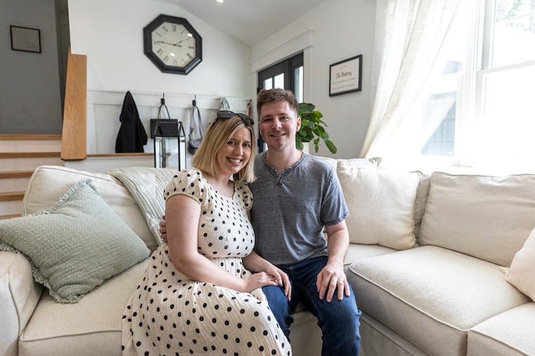 Tom Matera, 27, and Emily Matera, 27, sit in the living room of their home in Linwood, N.J. They had dreamed of owning a home near Ocean City when they found their house in 2023.