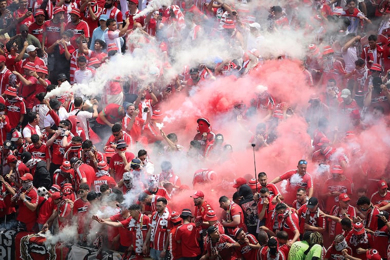 Red and white smoke floats over the Wydad fan section in the second half as they play Manchester City in a Club World Cup Group G match at Lincoln Financial Field in Philadelphia on Wednesday, June 18, 2025.