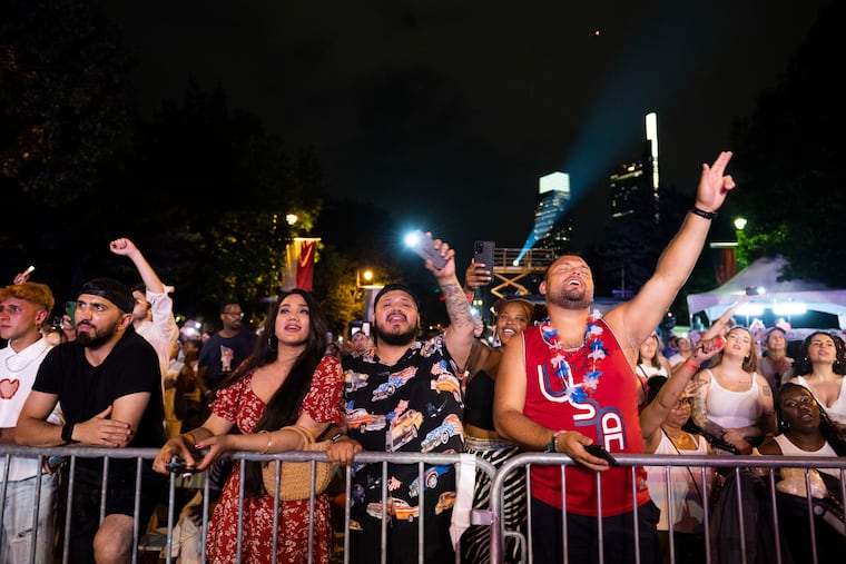 People raise their phone lights as they watch Demi Lovato’s performance at the Wawa Welcome America Festival on Tuesday, July 4, 2023. This year, LL Cool J and Jazmine Sullivan take the main stage.