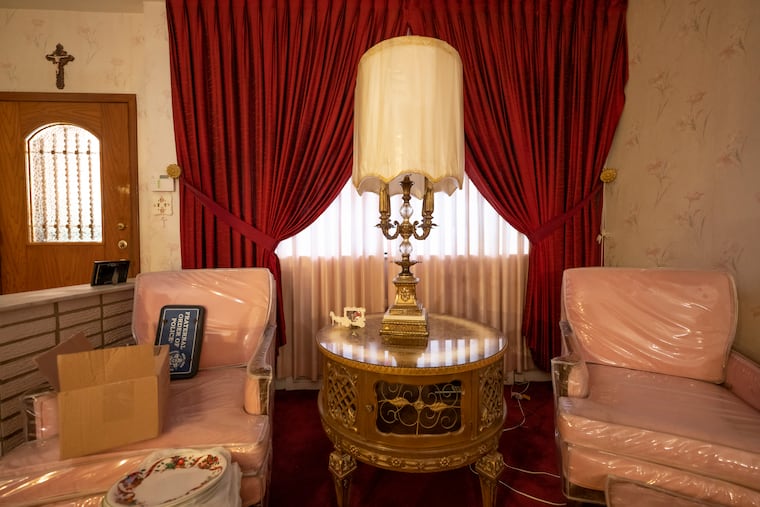 The vintage furniture in this South Philly rowhouse was perfectly preserved by clear vinyl covers. 