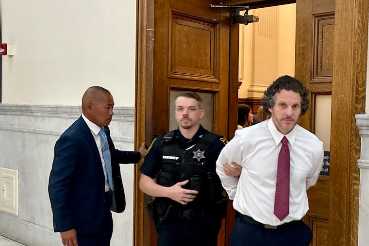 William Ciccoli Jr. is escorted out of a courtroom in the Montgomery County Courthouse during his trial for allegedly shooting a Pottstown Police officer with his own weapon.