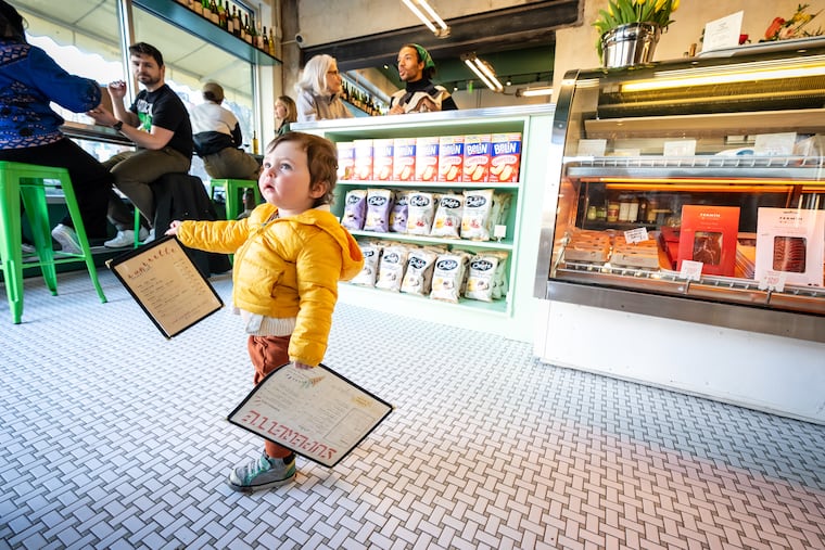 A young visitor at Supérette, a restaurant, bottle shop, French market, and wine bar at 1538 E. Passyunk Ave., on March 7, 2025.
