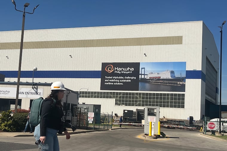 The gate and shed at Hanwha Philly Shipyard on the site of the former Philadelphia Naval Base. The company's Korea-based owners want to expand its space so its workforce can build and maintain more ships, including U.S. Navy drones and other craft.