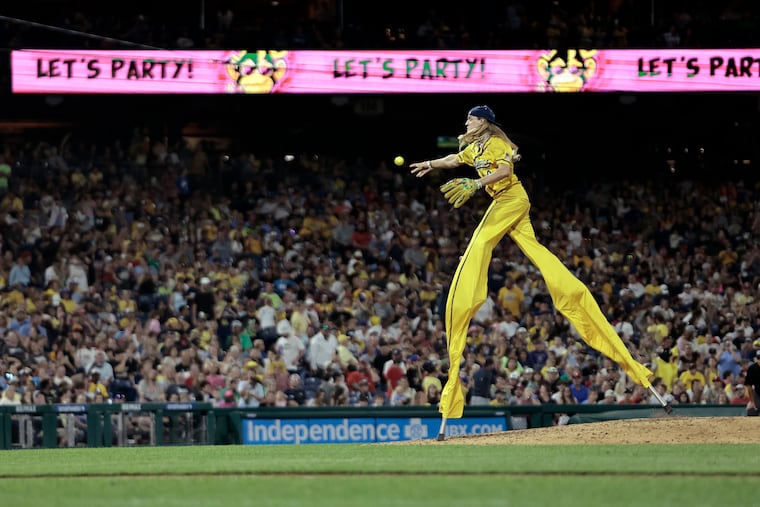 The Savannah Bananas' Dakota Albritton pitches while on stilts during the 2024 Banana Ball World Tour at Citizens Bank Park last fall.