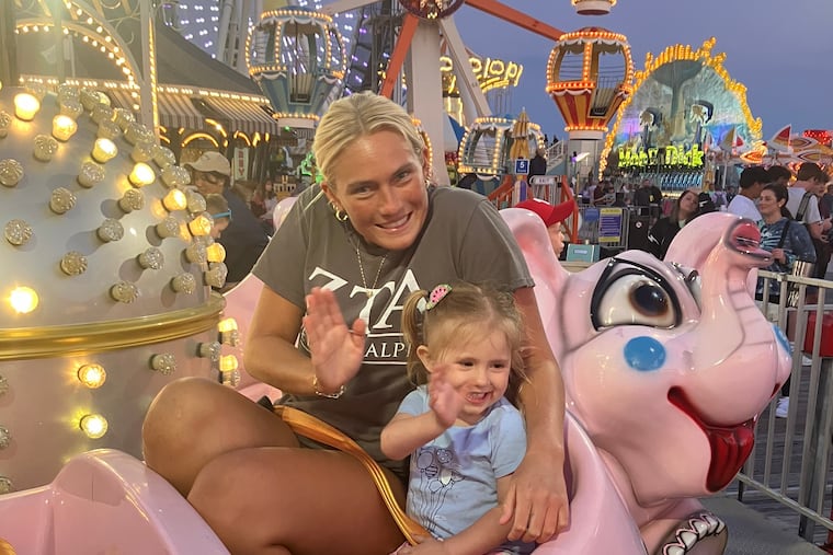 The author's daughters, Remi, 19, and Penelope, 3, at Morey's Piers in Wildwood in June.
