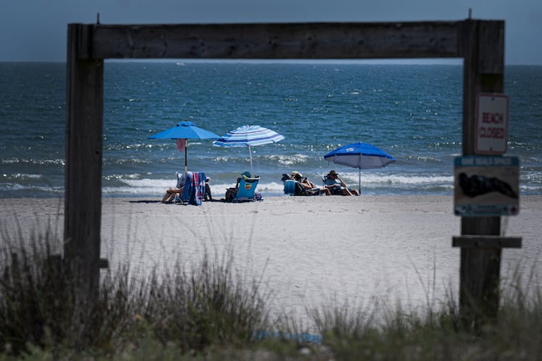 Beachgoers relaxed on Thursday, June 20, 2024, at the shore in Ventnor, N.J.