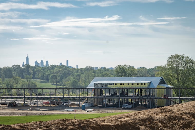 The Lincoln Financial Center at Cobbs Creek under construction in April. The building will contain the tavern, driving range, and event space.