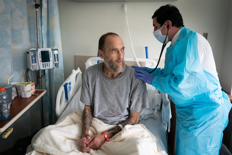 Joseph Kunz undergoes an examination at Cooper University Hospital in Camden. He had been using tranq at the time; eight months later, his life has taken another turn.