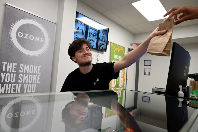 Jaidin Flanagan serves a customer at Legal Distribution micro dispensary in Atlantic City. Legal weed sales started two years ago in New Jersey, but the Shore hasn't opened the floodgates to weed just yet.