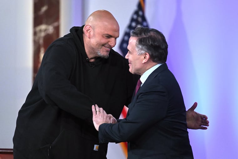 Sen. John Fetterman, D-Pa., left, and Sen. Dave McCormick, R-Pa., right, greet before participating in a debate moderated by Fox News anchor Shannon Bream, not shown, Monday, June 2, 2025, at the Edward M. Kennedy Institute for the United States Senate, Monday, June 2, 2025, in Boston, as livestreamed on Fox Nation. (AP Photo/Steven Senne)