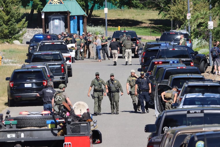 Law enforcement and emergency responders at Cherry Hill Park off 15th Street on Sunday, June 29, 2025, following reports of an ambush shooting attack on Canfield Mountain, in Coeur d'Alene, Idaho.
