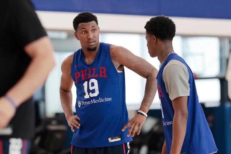 Justin Edwards (left), pictured with VJ Edgecombe, is the veteran of the Sixers summer league team.